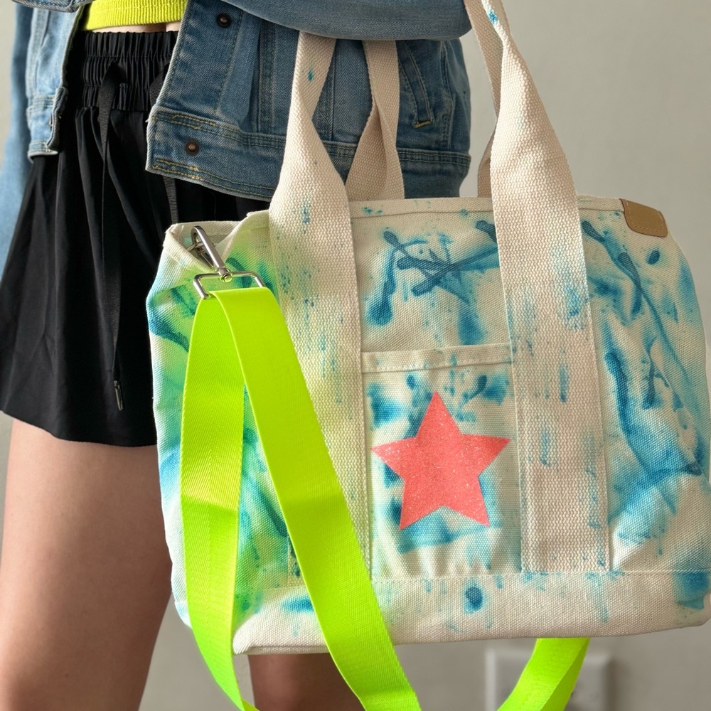 Customized canvas tote with shoulder straps and neon crossbody strap